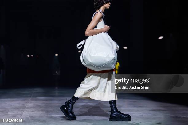 Model, bag and shoe detailwalks the runway at the Jil Sander fashion show during the Milan Fashion Week Womenswear Fall/Winter 2023/2024 on February...