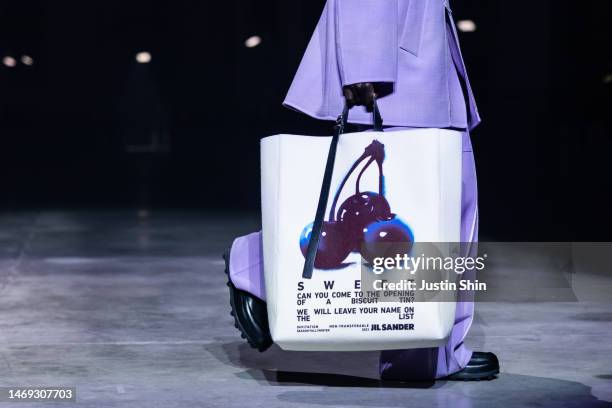Model, bag detail, walks the runway at the Jil Sander fashion show during the Milan Fashion Week Womenswear Fall/Winter 2023/2024 on February 24,...