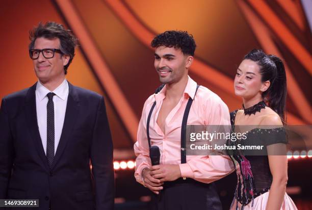 Daniel Hartwich with Malika Dzumaev and Younes Zarou on stage during the first "Let's Dance" show at MMC Studios on February 24, 2023 in Cologne,...