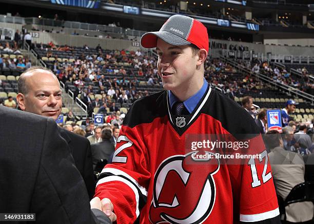 Damon Severson, 60th overall pick by the New Jersey Devils, shakes hands during day two of the 2012 NHL Entry Draft at Consol Energy Center on June...