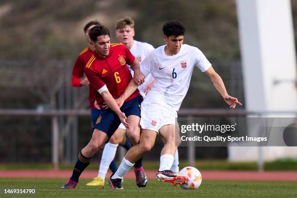 Mario Martin of Spain U19 battle for the ball with Isak Tomar Hjorteseth of Norway U19 during a Friendly match between Spain U19 and Norway U19 at...