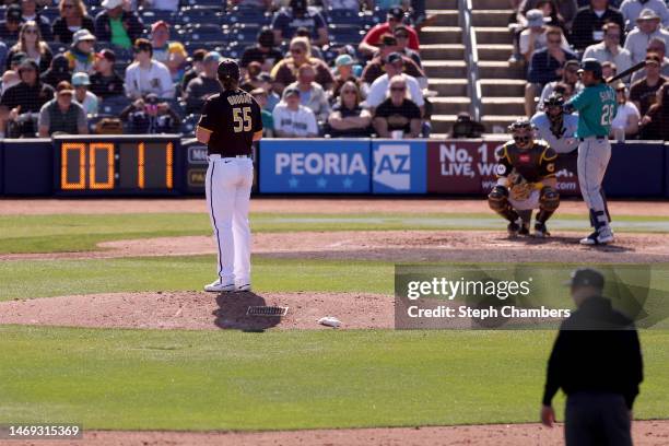 Pitch clock counts down as Jay Groome of the San Diego Padres prepares to deliver a pitch to Eugenio Suarez of the Seattle Mariners during the sixth...