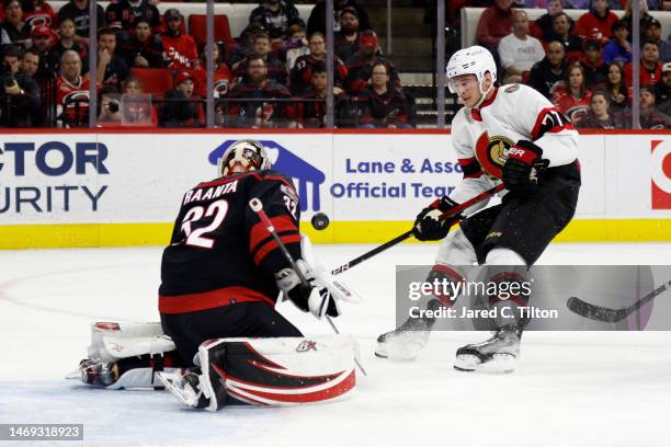 Antti Raanta of the Carolina Hurricanes makes a save against Julien Gauthier of the Ottawa Senators during the first period of the game at PNC Arena...