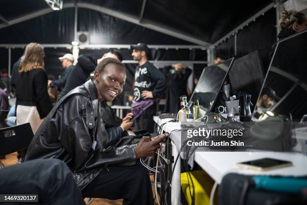 Model poses in the backstage at the Jil Sander fashion show during the Milan Fashion Week Womenswear Fall/Winter 2023/2024 on February 24, 2023 in...