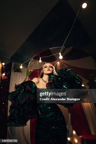 female portrait of beautiful woman at the performance show indoors, fashion style with light effects. circus and cabaret photography, vintage burlesque photo. - vintage burlesque stock pictures, royalty-free photos & images