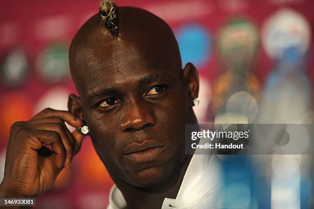 In this handout image provided by UEFA, Mario Balotelli of Italy talks to the media during a UEFA EURO 2012 press conference at the Olympic Stadium...