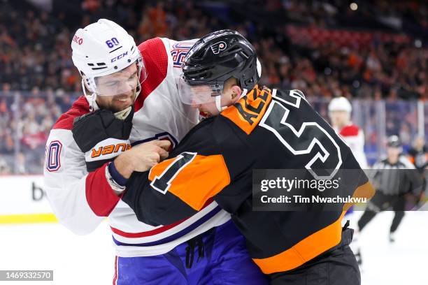 Alex Belzile of the Montreal Canadiens and Wade Allison of the Philadelphia Flyers fight during the second period at Wells Fargo Center on February...