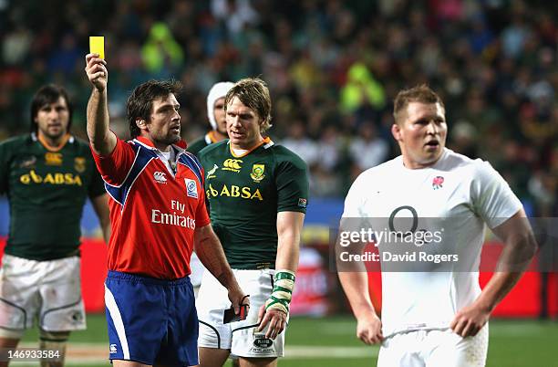 Dylan Hartley, the England captain is shown the yellow card by referee Steve Walsh during the third test match between the South Africa Springboks...