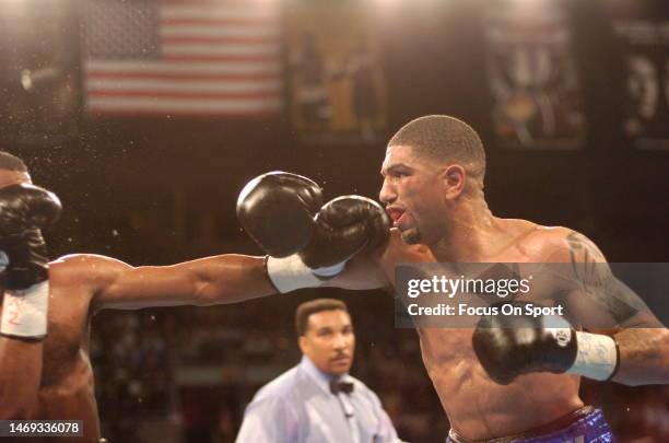 Sugar Shane Mosley, black trunks and Winky Wright, white trunks fight for the WBA, WBC, The Ring, and IBF light middleweight titles on March 13, 2004...