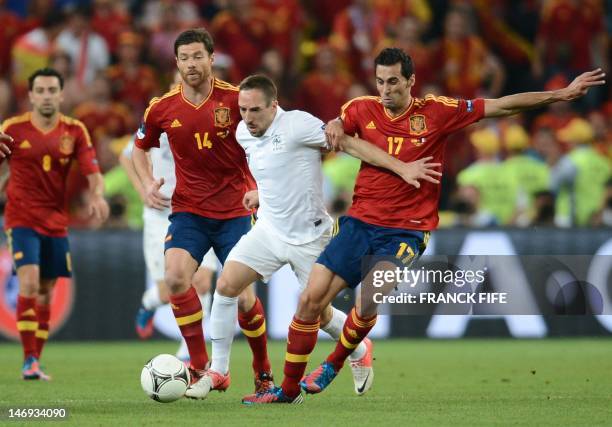 French midfielder Franck Ribery vies with Spanish defender Alvaro Arbeloa during the Euro 2012 football championships quarter-final match Spain vs...