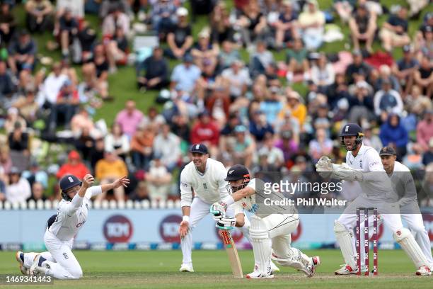 Ollie Pope of England catches out Daryl Mitchell of New Zealand during day two of the Second Test Match between New Zealand and England at Basin...