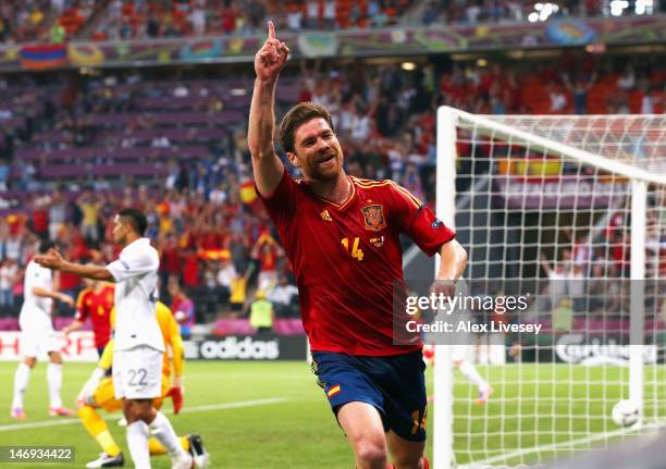 Xabi Alonso of Spain celebrates after scoring the first goal during the UEFA EURO 2012 quarter final match between Spain and France at Donbass Arena...