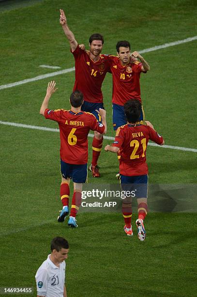 Spanish midfielder Cesc Fabregas celebrates with Spanish midfielder Cesc Fabregas , Spanish midfielder Andres Iniesta and Spanish midfielder David...