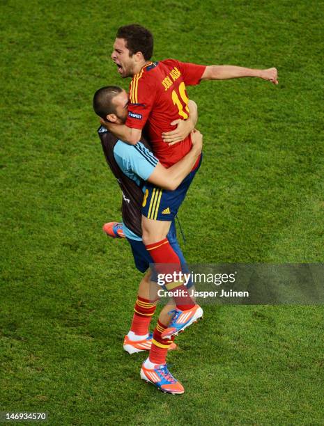 Jordi Alba of Spain celebrates with Alvaro Negredo after the first goal scored by Xabi Alonso during the UEFA EURO 2012 quarter final match between...