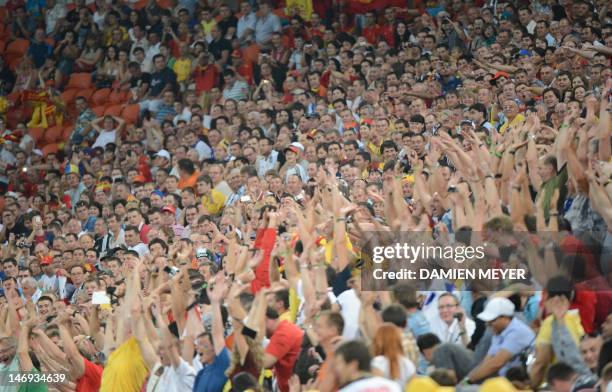 Spanish fans celebrates after a goal during the Euro 2012 football championships quarter-final match Spain vs France on June 23, 2012 at the Donbass...