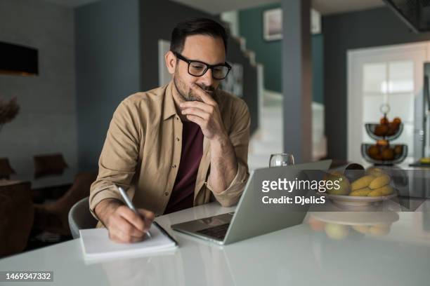 young man working at home. - thinking stock pictures, royalty-free photos & images