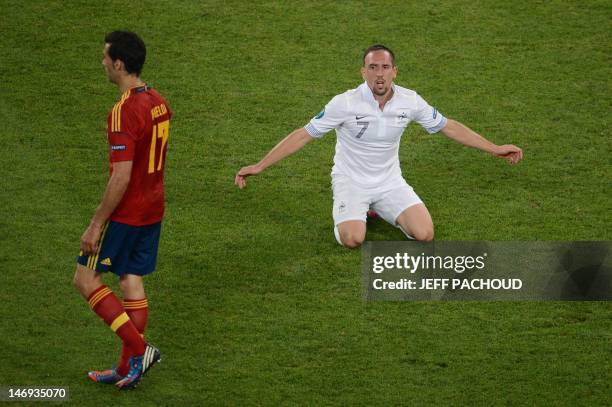 French midfielder Franck Ribery reacts next to Spanish defender Alvaro Arbeloa during the Euro 2012 football championships quarter-final match Spain...