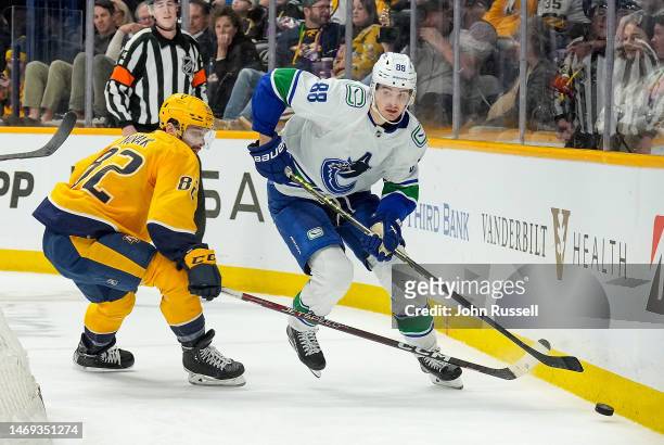 Nils Aman of the Vancouver Canucks skates against the Nashville Predators during an NHL game at Bridgestone Arena on February 21, 2023 in Nashville,...