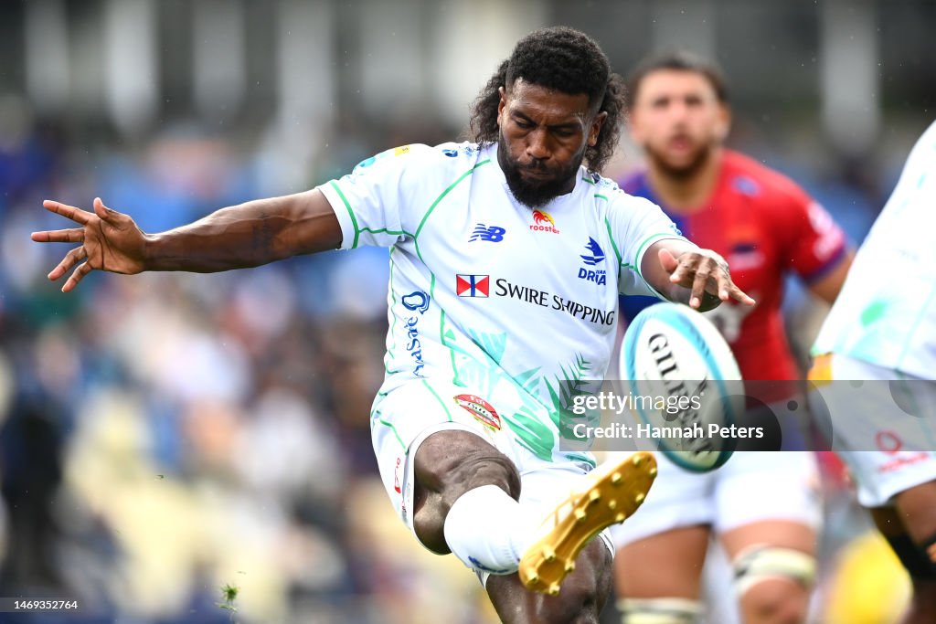 Frank Lomani of the Fijian Drua kicks the ball through during the ...