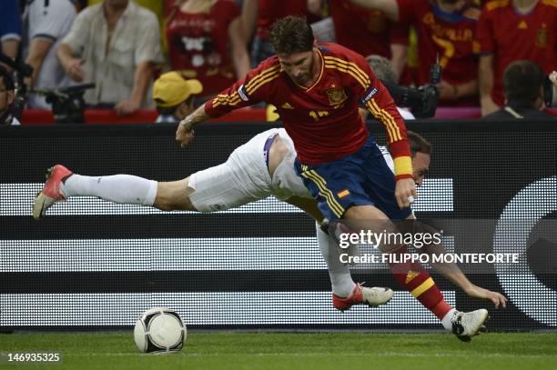 Spanish defender Sergio Ramos vies with French midfielder Franck Ribery during the Euro 2012 football championships quarter-final match Spain vs...