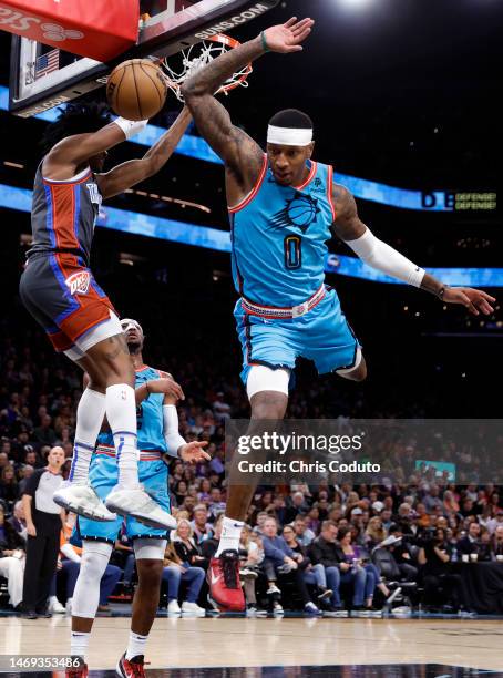 Jalen Williams of the Oklahoma City Thunder dunks over Torrey Craig of the Phoenix Suns during the first half at Footprint Center on February 24,...