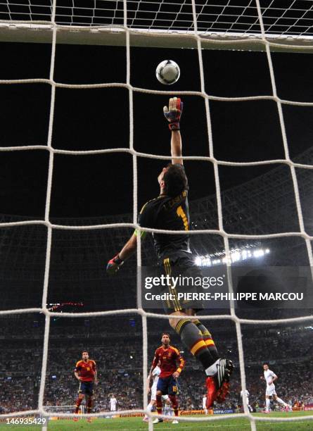 Spanish goalkeeper Iker Casillas jumps for the ball during the Euro 2012 football championships quarter-final match Spain vs France on June 23, 2012...