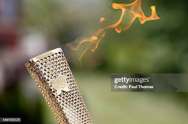 The Olympic Flame is seen on the Torch Relay leg between Lytham St Anne's and Manchester on June 23, 2012 in Manchester, England. The Olympic Flame...