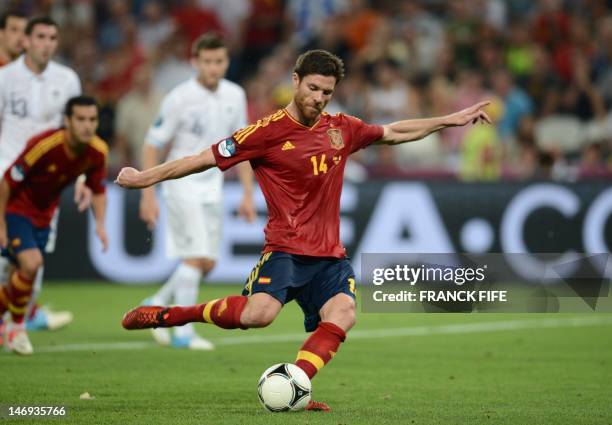 Spanish midfielder Xabi Alonso shoots to score a penalty during the Euro 2012 football championships quarter-final match Spain vs France on June 23,...