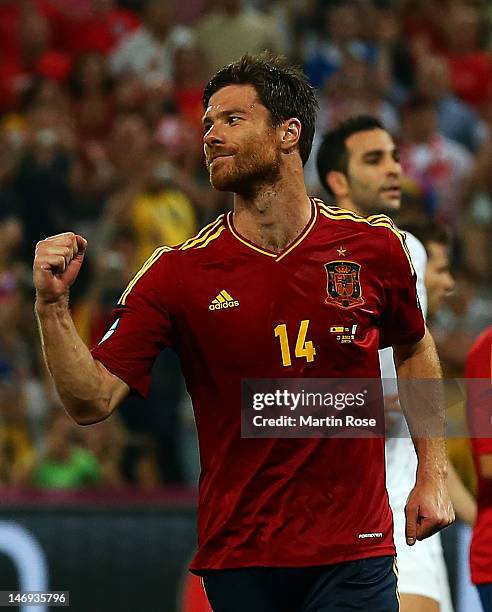 Xabi Alonso of Spain celebrates after scoring the second goal from the penalty spot during the UEFA EURO 2012 quarter final match between Spain and...