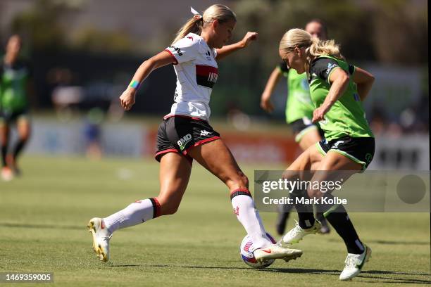 Sophie Harding of the Wanderers is tackled during the round 15 A-League Women's match between Canberra United and Western Sydney Wanderers at...