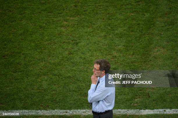 French headcoach Laurent Blanc reacts at the end of the Euro 2012 football championships quarter-final match Spain vs France on June 23, 2012 at the...
