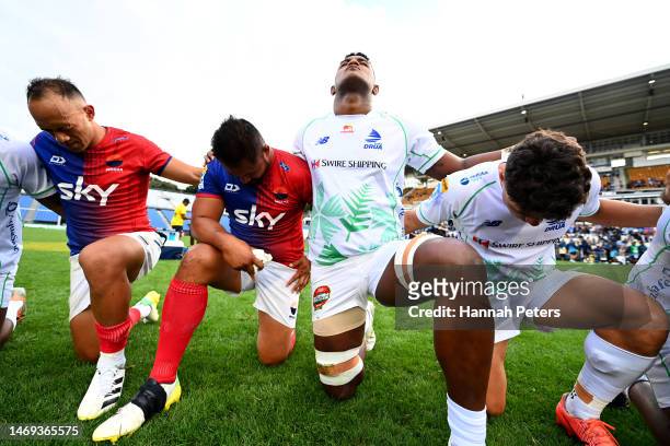 Christian Leali'ifano of Moana Pasifika prays with his team and the Fijian Drua after losing the round one Super Rugby Pacific match between Moana...