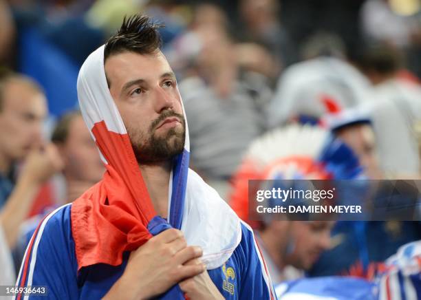 French fan reacts at the end of the Euro 2012 football championships quarter-final match Spain vs France on June 23, 2012 at the Donbass Arena in...
