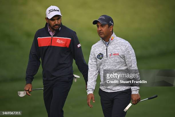Gaganjeet Bhullar and Shiv Kapur of India talk together during Day Three of the Hero Indian Open at Dlf Golf and Country Club on February 25, 2023 in...