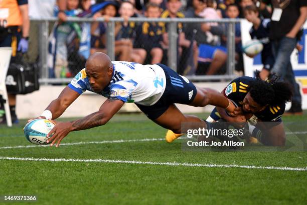 Mark Telea of the Blues scores the opening try during the round one Super Rugby Pacific match between Highlanders and Blues at Forsyth Barr Stadium,...