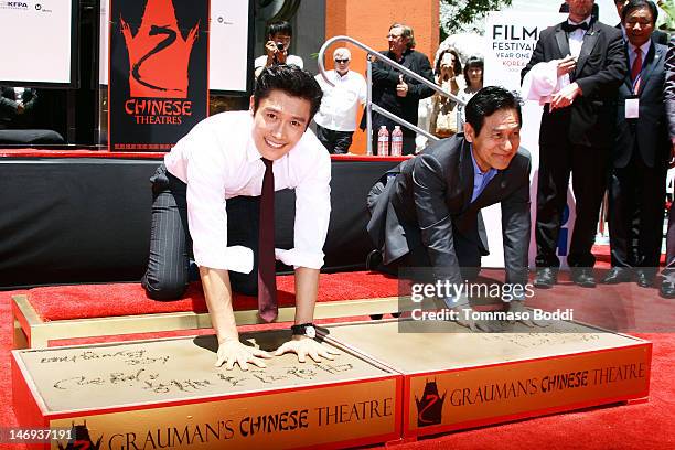 Actor Lee Byung-hun and Ahn Sung-ki attend the Look East Korean Film Festival - Korean actors Lee Byung-Hun and Ahn Sung-Ki hand and footprint...