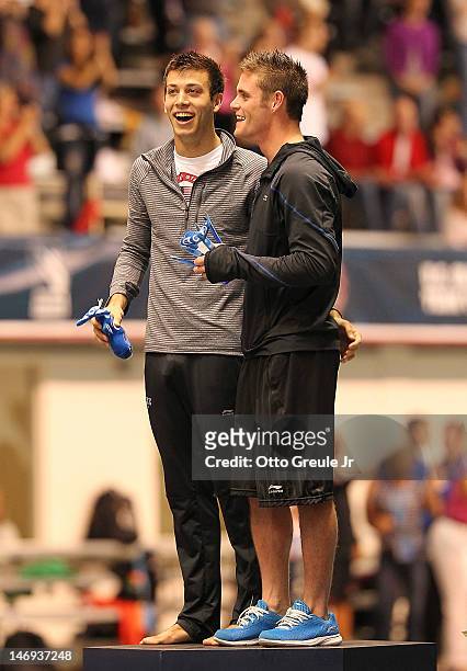 Nick McCrory and David Boudia collect their trophies after the 10m platform final at the 2012 U.S. Olympic Team Trials at the Weyerhaeuser King...