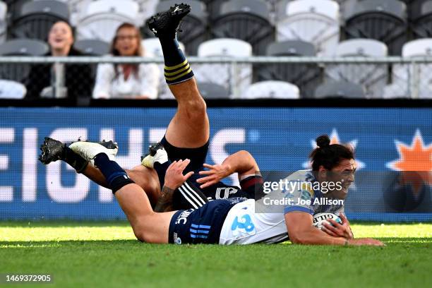 Caleb Clarke of the Blues scores a try during the round one Super Rugby Pacific match between Highlanders and Blues at Forsyth Barr Stadium, on...