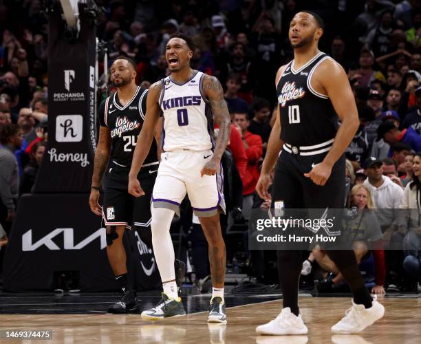 Malik Monk of the Sacramento Kings reacts to the end of game buzzer between Norman Powell and Eric Gordon of the LA Clippers during a 176-175 double...
