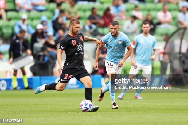 Luke Brattan of Sydney FC competes for the ball against Valon Berisha of Melbourne City of Sydney FC during the round 18 A-League Men's match between...