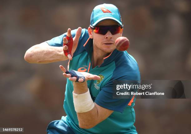 Steve Smith of Australia catches the ball during an Australia Test squad training session at Arun Jaitley Stadium on February 25, 2023 in Delhi,...