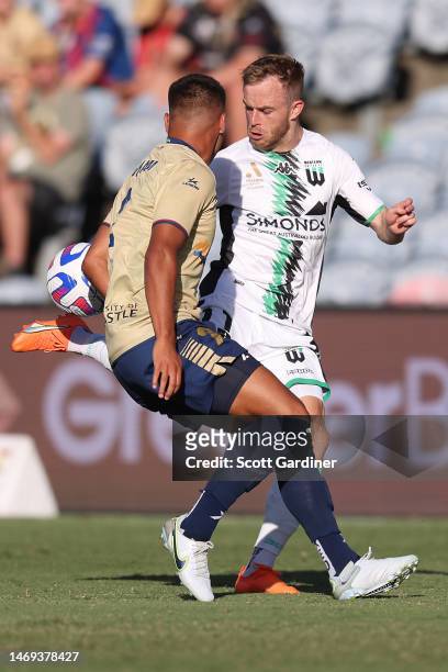 Connor Pain of Western United and Dane Ingham of the Jets compete for the ball during the round 18 A-League Men's match between Newcastle Jets and...