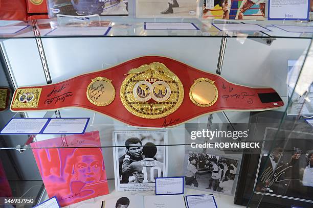 An official International Boxing Federation Championship belt signed by boxing greats Muhammad Ali, Joe Frazier, Hector Camacho and Sugar Ray Leonard...