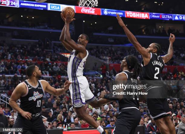 Harrison Barnes of the Sacramento Kings attempts a shot between Eric Gordon, Terance Mann and Kawhi Leonard of the LA Clippers during a 176-175...