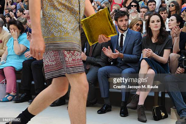 Roo Panes and Michelle Dockery attend the Burberry Prorsum show as part of Milan Fashion Week Menswear Spring/Summer 2013 on June 23, 2012 in Milan,...