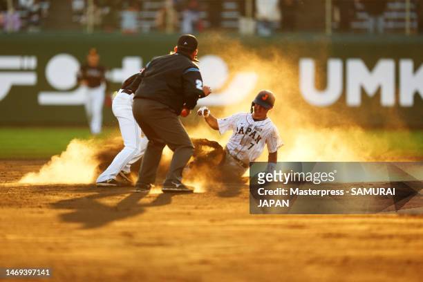 Infielder Takumu Nakano of Samurai Japan steals the scond base during the tie break practice following the practice game between Samurai Japan and...