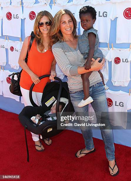 Personality Jillian Michaels , partner Heidi Rhoades , son Phoenix and daughter Lukensia attend LG's "20 Magic Minutes: A Family Affair" hosted by...