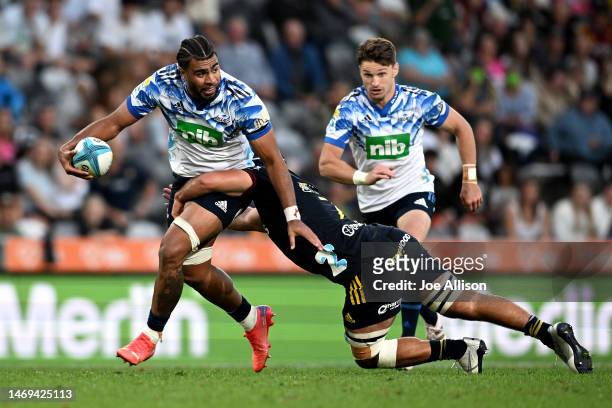 Hoskins Sotutu of the Blues charges forward during the round one Super Rugby Pacific match between Highlanders and Blues at Forsyth Barr Stadium, on...
