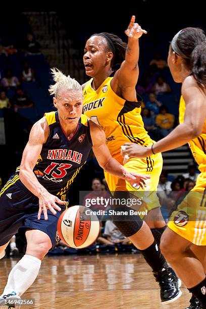 Erin Phillips of the Indiana Fever moves the ball against Amber Holt of the Tulsa Shock during the WNBA game on June 23, 2012 at the BOK Center in...