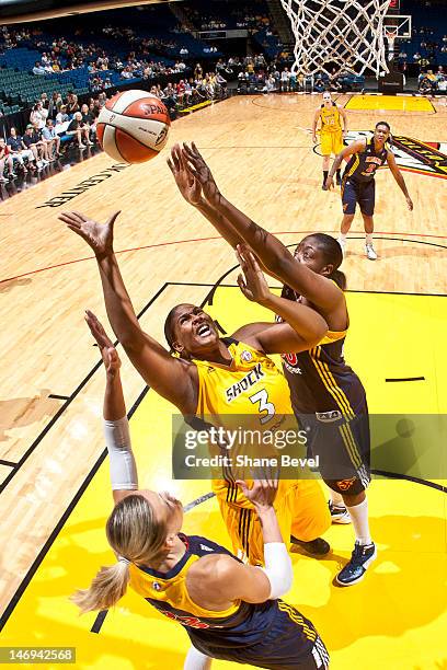 Courtney Paris of the Tulsa Shock shoots against Jessica Davenport and Katie Douglas of the Indiana Fever during the WNBA game on June 23, 2012 at...